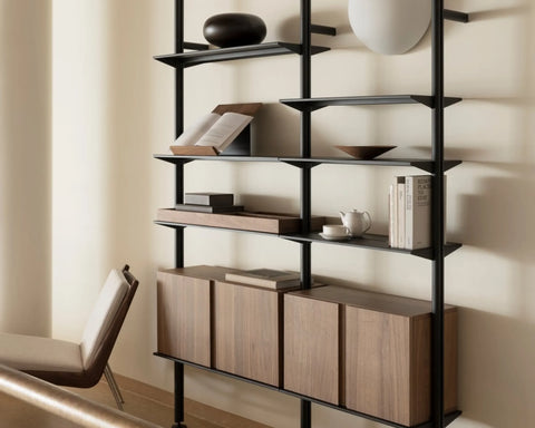 String Pira shelving in black grey with a row of walnut cabinets and a magazine shelf