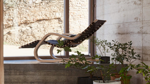 Lounge Chair 43 by Alvar Aalto for Artek with bent birch frame and black linen webbing, styled by a window