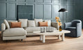 Blu Dot Good Times oval coffee table in white oak styled in a modern living room with a linen sectional sofa and blue swivel chair