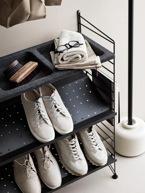Black String® System shoe shelves, 30.7"W, styled with sneakers and felt bowl shelf for entryway storage