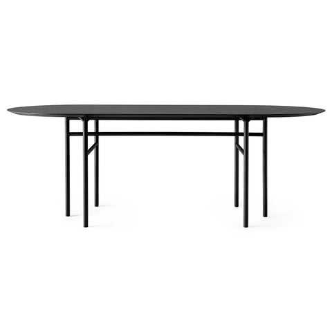 Audo Copenhagen Snaregade Dining Table, Oval in Black Oak Veneer, packshot on white