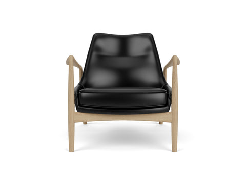 seal lounge chair in natural oak and Dakar 0842 black leather designed by ib Kofod-Larsen for audo copenhagen