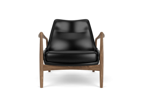 seal lounge chair in black Dakar 0842 leather and walnut base designed by ib Kofod-Larsen for audo copenhagen