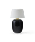 black torso table lamp portable designed by Kroeyer-Saetter-Lassen for audo copenhagen