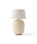 torso table lamp portable designed by Kroeyer-Saetter-Lassen in sand finish for audo copenhagen