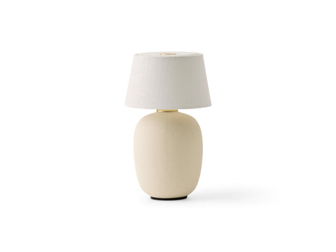 torso table lamp portable designed by Kroeyer-Saetter-Lassen in sand finish for audo copenhagen