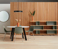 Blu Dot Bobber Large Pendant in black above a round white dining table with olive green chairs and a wood slat wall