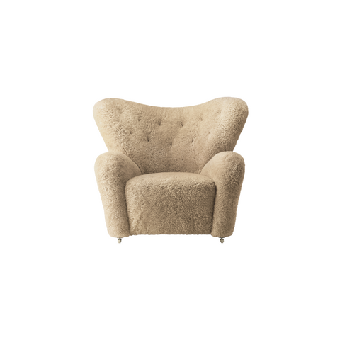 Audo Copenhagen The Tired Man Lounge Chair in Dark Stained Oak with Sheepskin Honey, packshot on white