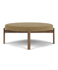 passage pouf ottoman by audo copenhagen finished in audo boucle fabric and walnut base