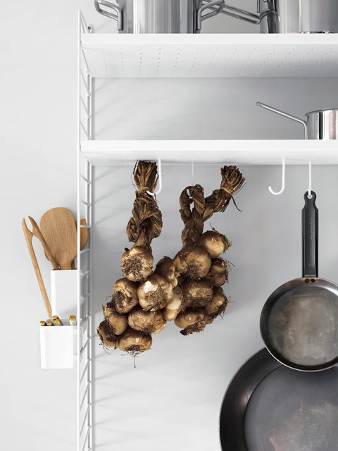 White String® System shelving with J-hooks used for hanging garlic and kitchen pans