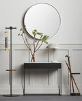Blu Dot Construct 1 Drawer Console in Carrara marble and black powder-coated steel, styled in a modern entryway with a large round Hoopla mirror, branch arrangement in glass vase, and white dome table lamp