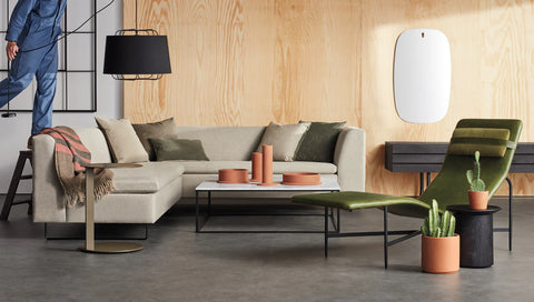Blu Dot Bonnie and Clyde Sectional Sofa in light grey fabric styled in a modern industrial living room