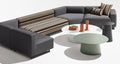 Blu Dot Circula Low Side Table in grey green and white styled with a modular outdoor sofa on white background
