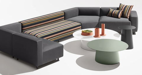 Blu Dot Circula Low Side Table in grey green and white styled with a modular outdoor sofa on white background