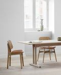 oborg Chair in Scandinavian dining room with oak table and pendant light lifestyle image Canada