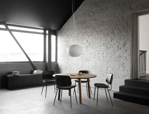 soborg chair with upholstered black leather seat and backrest designed by borge mogensen for fredericia furniture