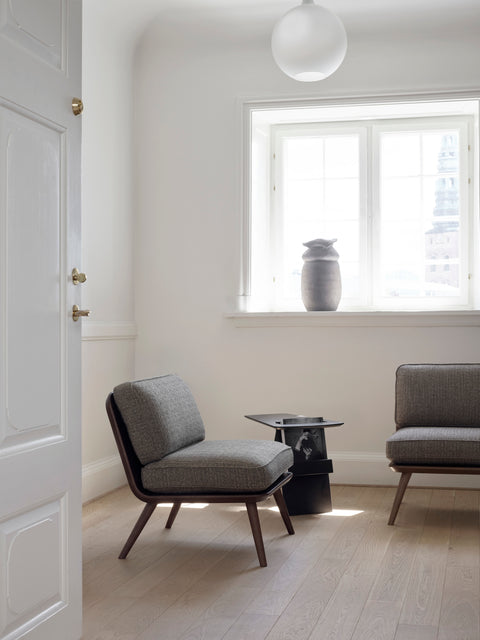 Spine Lounge Chairs by Fredericia in a bright Scandinavian room, dark oak frames with grey upholstery, designed by Space Copenhagen.