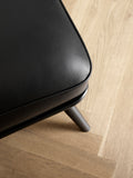 Close-up of Spine Lounge Chair by Fredericia highlighting premium upholstery and refined stitching detail