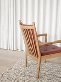 Minimalist interior with Wegner 1788 Easy Chair and neutral decor