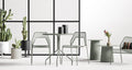 Hot Mesh 30" Café Table by Blu Dot in Grey Green, styled in outdoor setting with Hot Mesh chairs and side tables