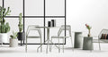 Circula Tall Side Table by Blu Dot in Grey Green, styled in an outdoor dining setting with Hot Mesh chairs and Plot planters