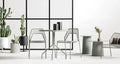 Plot Small Planter by Blu Dot in White and Oblivion, styled in an outdoor dining setting with Hot Mesh chairs and dining table