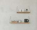 Frama Single Shelf, Natural Oak in Brass, two oak shelves on brass brackets with cups, a tin and a dark mug on a grey wall