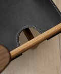 hunting chair detail with saddle black leather and lacquered oak frame by borge mogensen for fredericia furniture