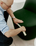 Shaping a green upholstered Gomo Lounge Chair by Fredericia, modern Danish design.