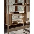 String Furniture Pira shelving system with black poles and walnut cabinets, modular steel shelving styled with books