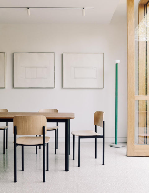 Dining room with PLAN Chairs by Fredericia in oak and upholstered seat, paired with a rectangular wooden table