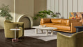 Blu Dot Good Times coffee table in a neutral living room with a tan leather sofa, olive velvet swivel chairs, and potted plants