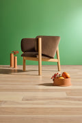 Blu Dot All In Lounge Chair rear detail in brown velvet with natural oak frame against a green wall