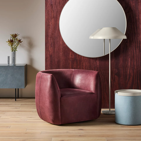 Blu Dot Council Lounge Chair in oxblood leather styled in a moody modern living room