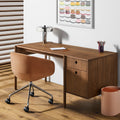 Blu Dot Cursive Desk in walnut styled in a warm modern home office with task chair and table lamp