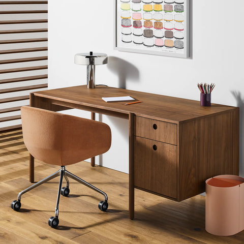 Blu Dot Cursive Desk in walnut styled in a warm modern home office with task chair and table lamp