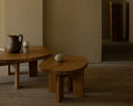 Frama Farmhouse Side Table in Natural Oak, two oak tables of different heights holding a jug, cups and a pale stone ball