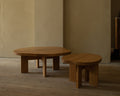Frama Farmhouse Coffee Table in Natural Oak, low oak table with a rounded top beside a smaller side table in a plaster walled room