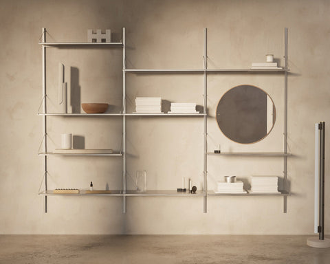 Frama Shelf Library Triple Section in Stainless Steel, steel shelves across three bays holding bowls, boxes and a round mirror