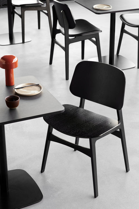 Søborg Chair black stained oak in a modern cafe setting by Fredericia