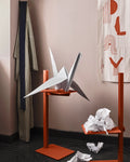 Museum Side Table in orange finish styled with origami paper crane and crumpled paper, Scandinavian modern design by String®