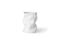 white ceramic vase with an organic shape by audo copenhagen