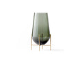 echasse vase designed by theresa rand in brushed brass metal base and smoked glass vase by audo copenhagen