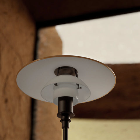 The 3½-2½ Floor Lamp Centenary Edition is based on Poul Henningsen’s System PH and features a three-shade set with White Opal lower shades and an Amber upper shade, all glossy on the outside and sandblasted matte white on the inner side to ensure a soft diffused and glare-free light and a high level of light comfort. The amber-coloured upper shade provides pleasant ambient upward glow.