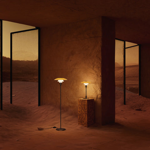 Louis Poulsen PH Centenary Edition floor lamp and PH 3/2 table lamp displayed together in a dramatic desert interior setting