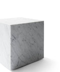 white cubic marble end table designed by norm architects for audo copenhagen