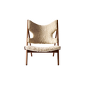 Audo Copenhagen Knitting Lounge Chair, Sheepskin in Walnut and Sheepskin Natural, packshot on white