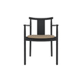Audo Copenhagen Merkur Dining Chair w/ Armrests in Black Oak with Sierra 1611 seat, packshot on white