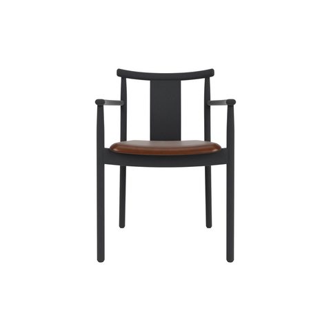 Audo Copenhagen Merkur Dining Chair w/ Armrests in Black Oak with Aida 0329 seat, packshot on white