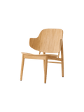 Audo Copenhagen The Penguin Wooden Lounge Chair in a styled interior